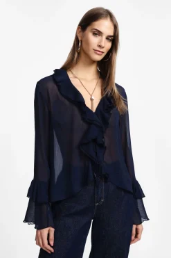 Camisa con mangas largas y volantes