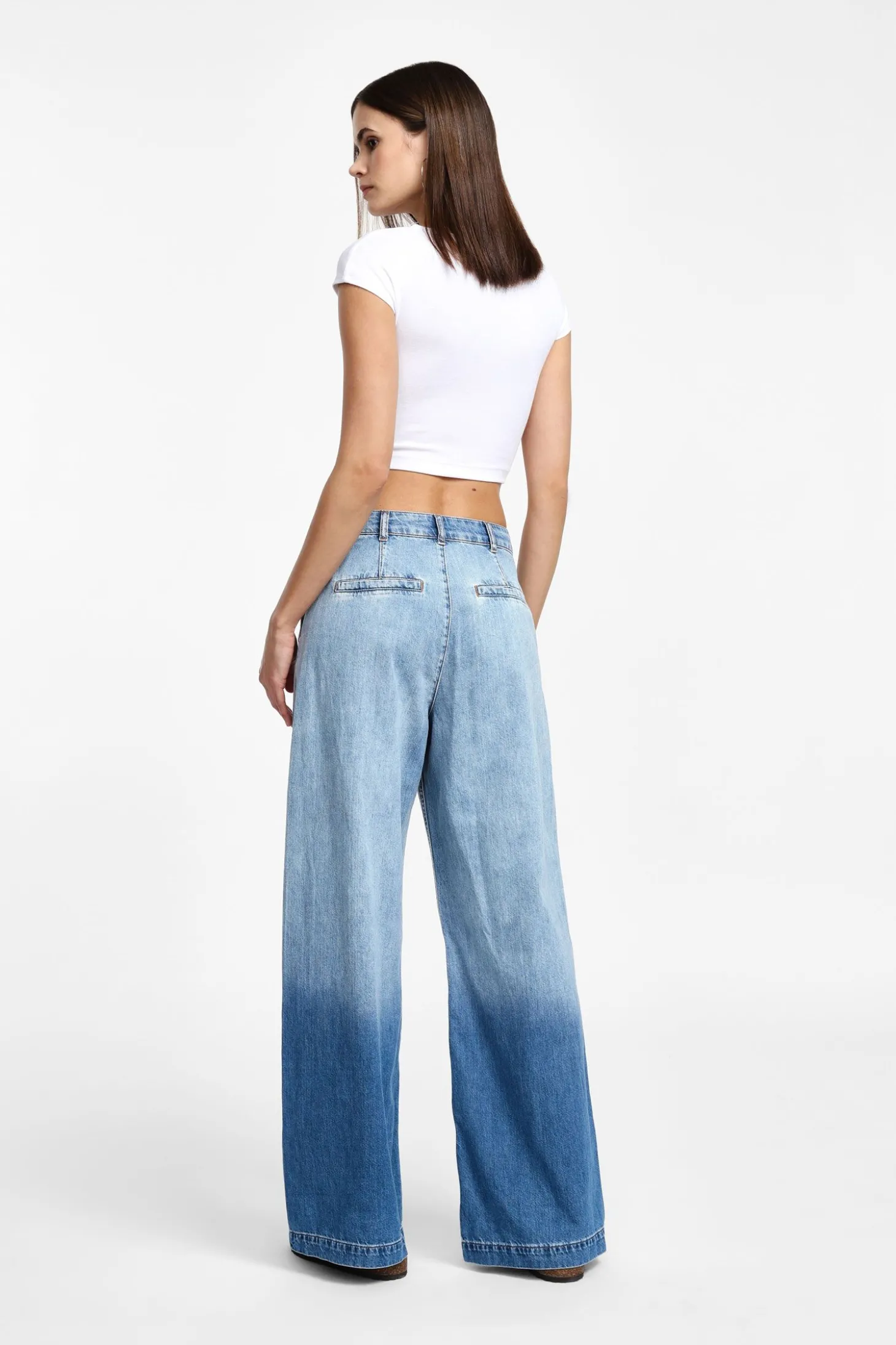 Jeans a gamba larga con vita media sfumati