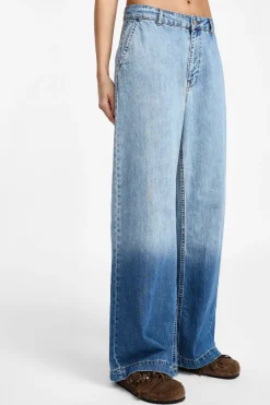 Jeans a gamba larga con vita media sfumati
