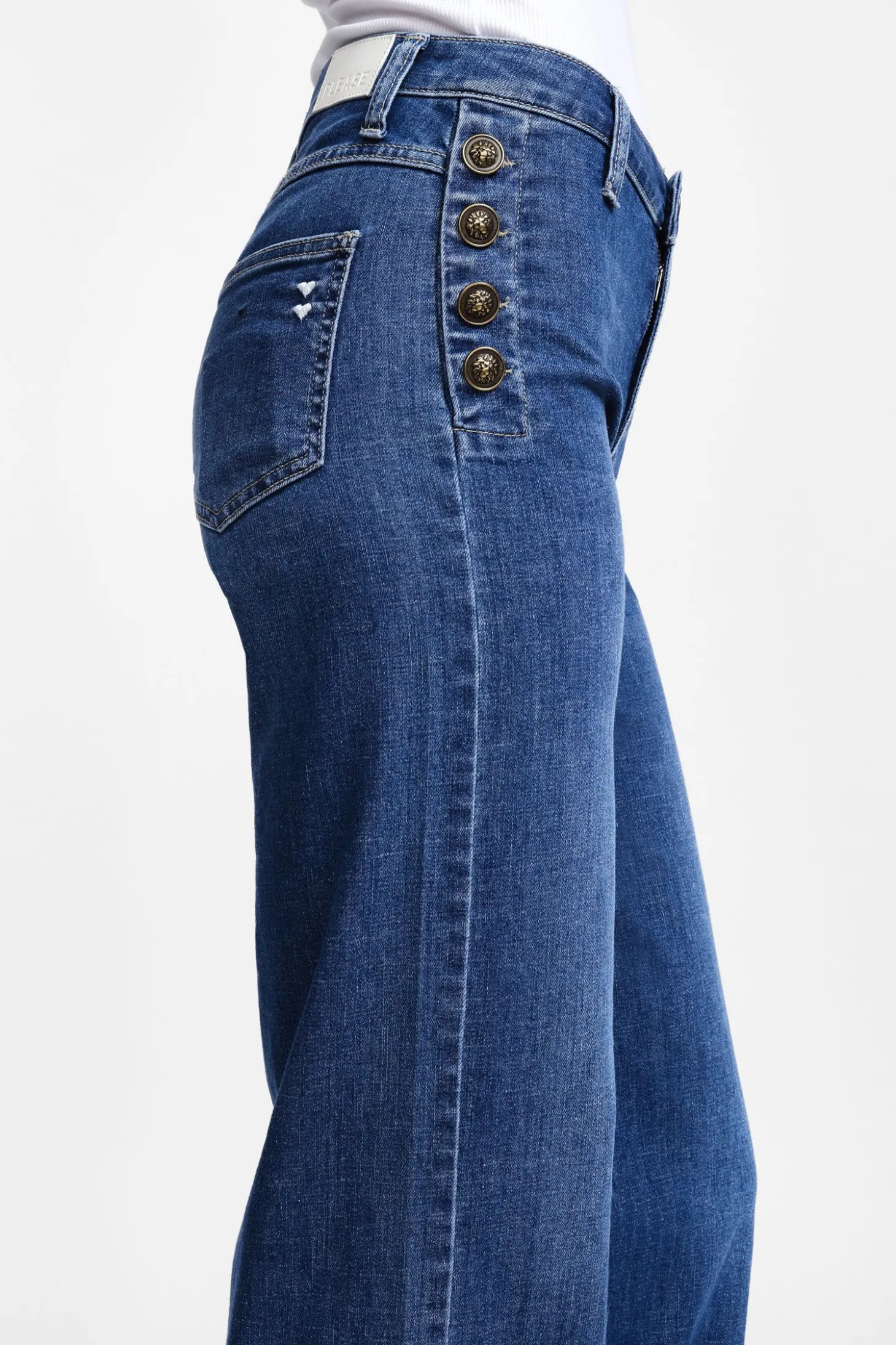 Jeans a zampa con bottoni laterali