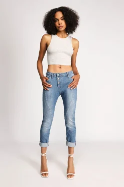 Jeans slim-fit effetto délavé con chiusura laterale e cuciture dettaglio